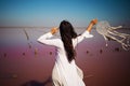 Dreamcatcher at sunset , asian girl boho chic with ethnic amulet at pink sea. symbol peace and harmony.