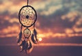 Dreamcatcher sunset sky, boho chic, ethnic amulet symbol Indigenous Peoples Day