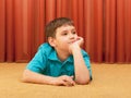 Dreaming boy on the floor Royalty Free Stock Photo