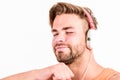 Dreaming and dancing to pleasant music. unshaven man listening music in headset. sexy muscular man listen sport music