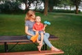 Dreaming of future. Mom and son playing with colored paper airplanes. Royalty Free Stock Photo