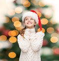 Dreaming girl in santa helper hat Royalty Free Stock Photo