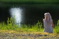 Dreaming girl on shore Royalty Free Stock Photo