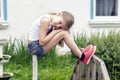 Dreaming girl sitting alone on the bridge