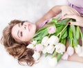 Dreaming lovely young girl with bouquet flowers Royalty Free Stock Photo