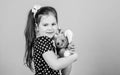 Dreaming of pet. small girl with soft bear toy. child psychology little girl playing game in playroom. happy childhood Royalty Free Stock Photo