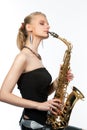 Dreaming sensual blonde with saxophone