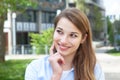 Dreaming young woman with blond hair outside Royalty Free Stock Photo