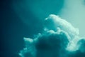 Dreamlike blue cloudscape against a dark sky Royalty Free Stock Photo