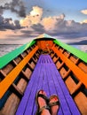 Dreamlike image of female feet in a rowing boat on Inle Lake, Myanmar