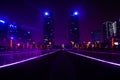 Dreamy blue-violet key tone of zhengzhou east station square, green space twin towers night Royalty Free Stock Photo