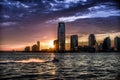 A Dreamlike Sunset over the Waters of Hudson River with Jersey City Skyline on the Horizon - Manhattan, New York City Royalty Free Stock Photo