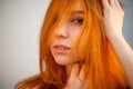 Dreammy portrait of shy redhead woman in soft focus Royalty Free Stock Photo