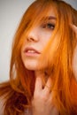 Dreammy portrait of shy redhead woman in soft focus Royalty Free Stock Photo