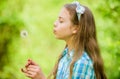 Dreams come true. Dandelion full symbolism. Summertime fun. Beliefs about dandelion. Girl making wish and blowing