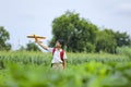 dreams of flight! indian child playing with toy airplane at green field