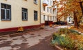 Dreamy autumn cityscape. Golden foliage in sunlight