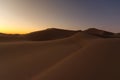 Dreamy desert concept at Twilight of dawn at desert dune of Erg Chigaga, at the gates of the Sahara. Morocco. Concept of travel