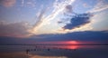 Dreamy and dramatic colorful sunset sky over water surface with cloud reflections