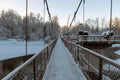 A dreamy frosty morning in December. Beautiful winter cold landscape in blue tones, bridge repair on the river Royalty Free Stock Photo