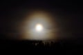 Dreamy full moon night sky over spruce tree forest and mountain Royalty Free Stock Photo