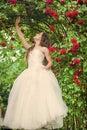 Dreamy girl ballroom dress in rose garden, fairy tale concept Royalty Free Stock Photo