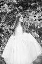 Dreamy girl ballroom dress in rose garden, magical garden concept