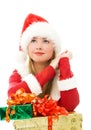 Dreamy girl with Christmas presents Royalty Free Stock Photo