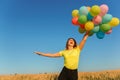 Dreamy girl jumping high with bunch of balloons Royalty Free Stock Photo