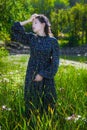 Dreamy girl on a summer sunny day walking in field Royalty Free Stock Photo