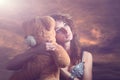 Dreamy girl with a teddy bear Royalty Free Stock Photo