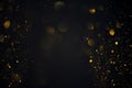 Dreamy golden swirly bokeh glitter lights dark background Royalty Free Stock Photo