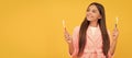 dreamy happy teen girl in home terry bathrobe hold toothbrush, health. Banner of child girl with teeth brush, studio Royalty Free Stock Photo