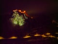 Dreamy Lake Bled with illuminated Bled castle and walkway at night in winter Royalty Free Stock Photo