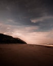 Dreamy landscape of empty beach at dawn in moody tones Royalty Free Stock Photo