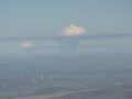 Dreamy misty landscape above the sea of clouds, town in mist