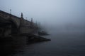 Dreamy morning view of the Charles Bridge with magical foggy atmosphere.