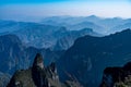 Dreamy mountain ranges landscape with misty sky in China