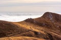 A dreamy mountain scene with clouds cover on a mountain hill. Pa