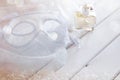 Dreamy photo of Vintage white venetian mask and perfume bottle Royalty Free Stock Photo