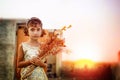Dreamy portrait of small little girl holding flowers Royalty Free Stock Photo