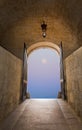 Dreamy purple full moon sky through the gates of medieval fairy tale gates