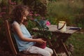 dreamy romantic kid girl relaxing in evening summer garden Royalty Free Stock Photo