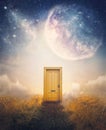 Dreamy scene with a mysterious door on a far away planet, fantastic cosmic sky on the background. Surreal adventure concept, magic Royalty Free Stock Photo