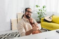 dreamy and smiling hispanic man with Royalty Free Stock Photo