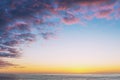 Dreamy sunset scenery Atlantic ocean, blue sky with pink clouds and copy space Royalty Free Stock Photo