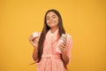 dreamy teen girl in home terry bathrobe with thermos bottle, daydreamer