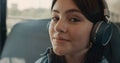 Dreamy girl face listening music with headphones closeup. Schoolgirl smiling. Royalty Free Stock Photo