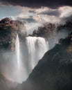 Dreamy waterfall in mountains on a cloudy day Royalty Free Stock Photo