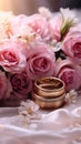 Dreamy wedding scene featuring gold rings, Eustoma roses, and light pink feathers Royalty Free Stock Photo
